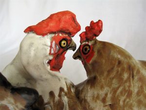 pair of hens mounted on wood