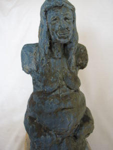 stylised head and torso of female nude, fertility figure