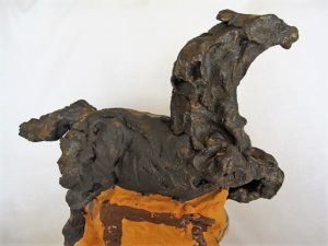 Leaping Horse, stylised ceramic sculpture in gold/brown with orange decorated stand