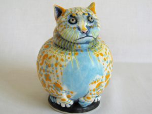 Porcelain cat sculpture with coloured decoration by Ellen Cooper