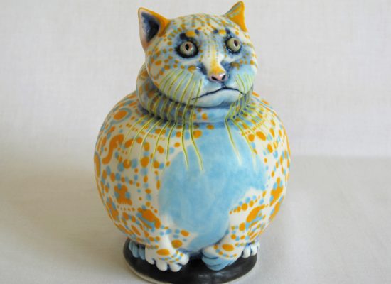 Porcelain cat sculpture with coloured decoration by Ellen Cooper